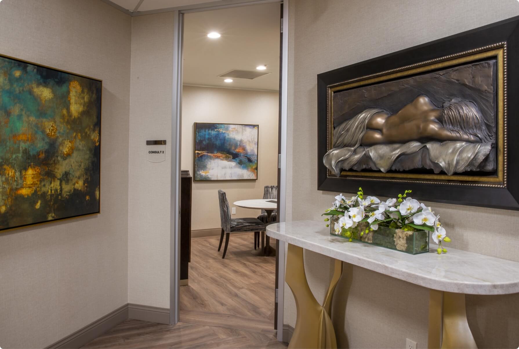 Office space with wall art and accent furniture