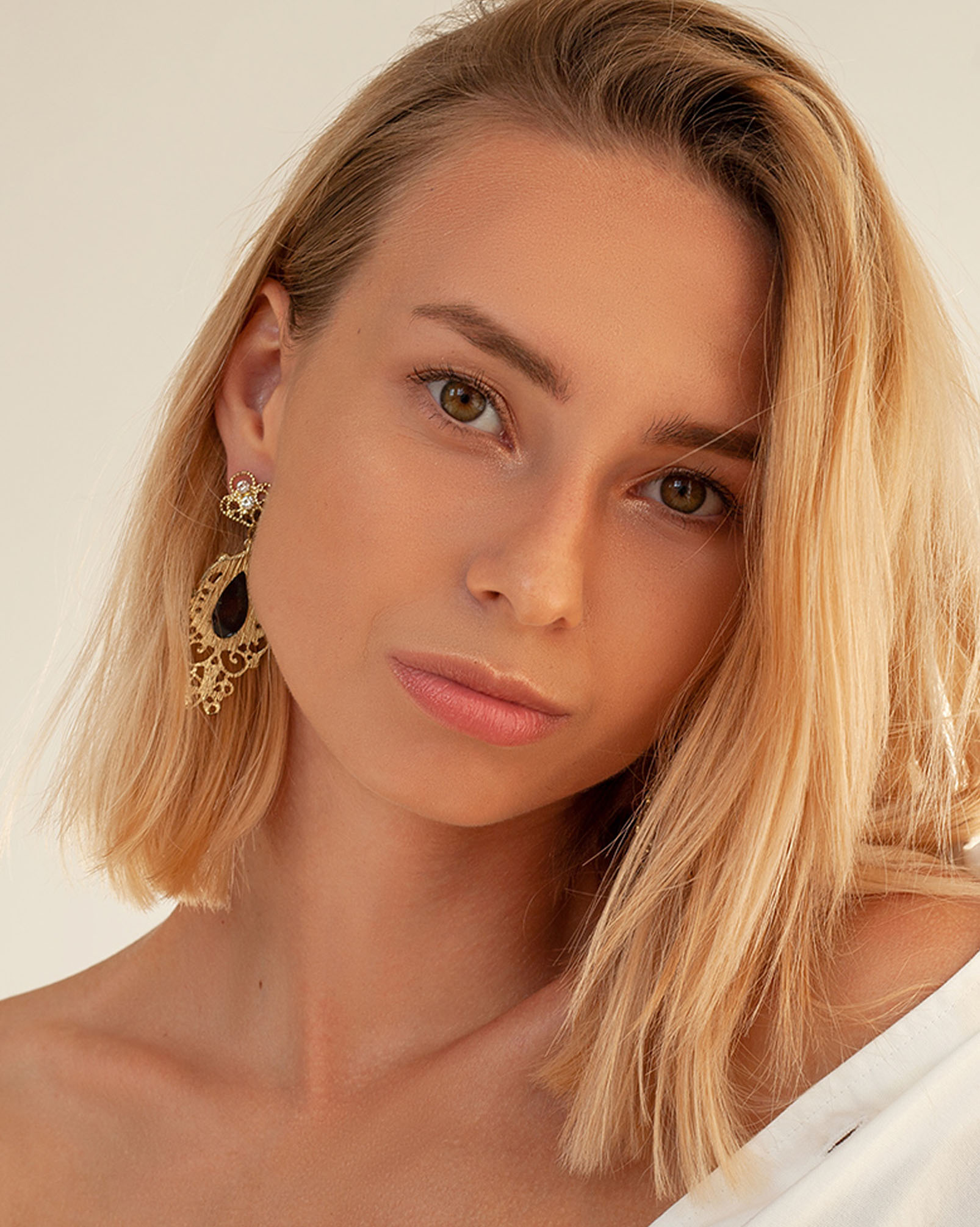 woman with blonde hair wearing white clothes