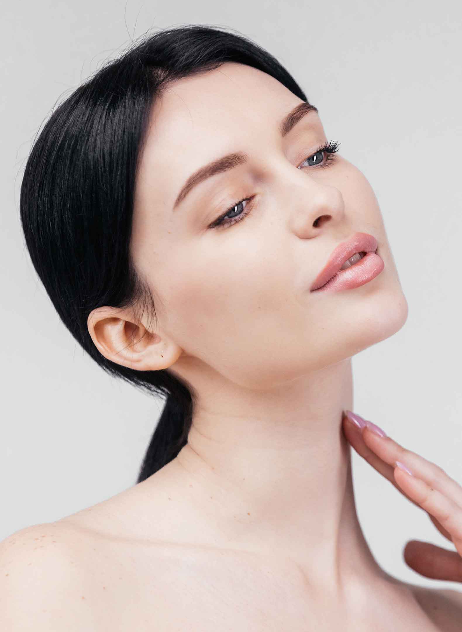 woman profile touching her neck