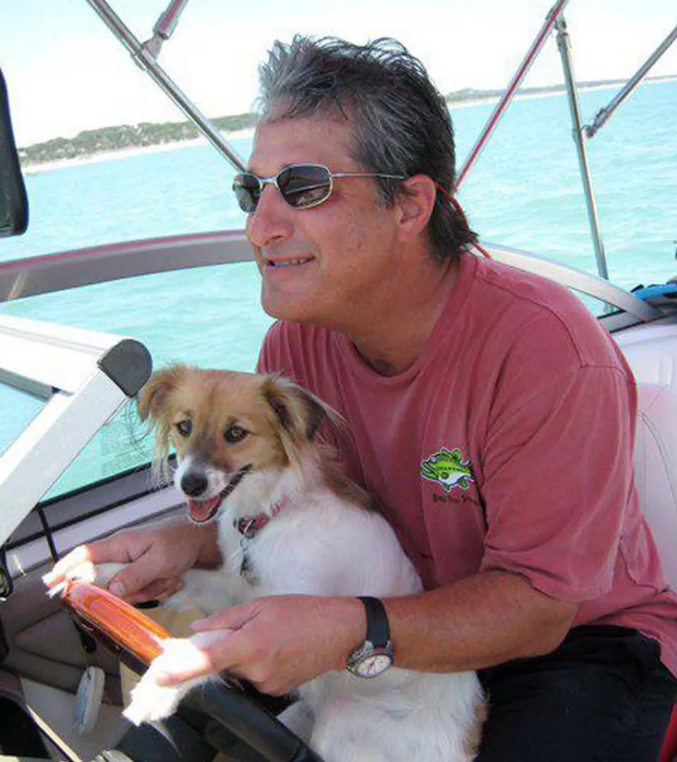 Dr. Patronella with his dog on a boat